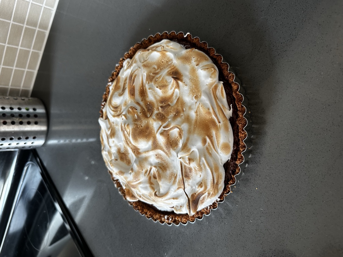 Chocolate s’mores tart topped with toasted marshmallow
